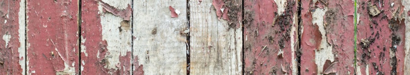 banner of Old wooden background with remains of pieces of scraps of old paint on wood