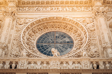 LECCE, ITALY /  SEPTEMBER 2019: The facade of the Basilica of Santa Croce in southern Italy.