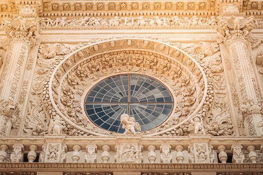 LECCE, ITALY /  SEPTEMBER 2019: The facade of the Basilica of Santa Croce in southern Italy.