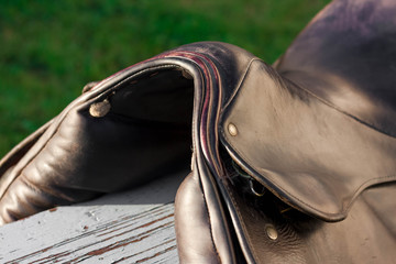 Pommel of brown english traditional dressage saddle. Close up.