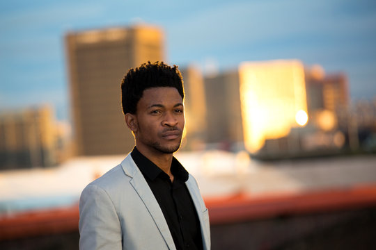 Portrait of business man at sunset
