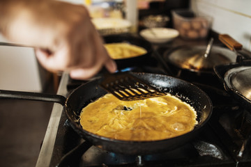 Professional chef working in restaurant kitchen and making delicious traditional food.