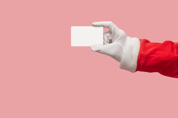 Santa Claus hand holding credit card.