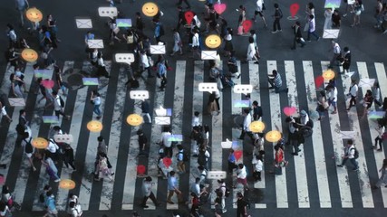 High Angle Shot of a Crowded Pedestrian Crossing in Big City. Augmented Reality of Social Media Signs, Symbols, Location Tracking and Emojis are Added to People. Future Technology Concept. - Powered by Adobe