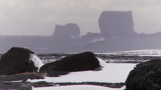 Rocky beach landscape in Iceland during winter, wide