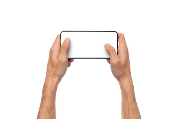 Male hands holding smartphone with blank screen, playing video games