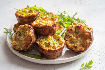 zucchini corn egg muffins on a table