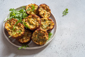 zucchini corn egg muffins on a table