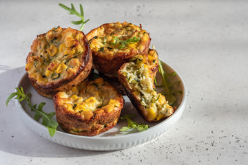 zucchini corn egg muffins on a table