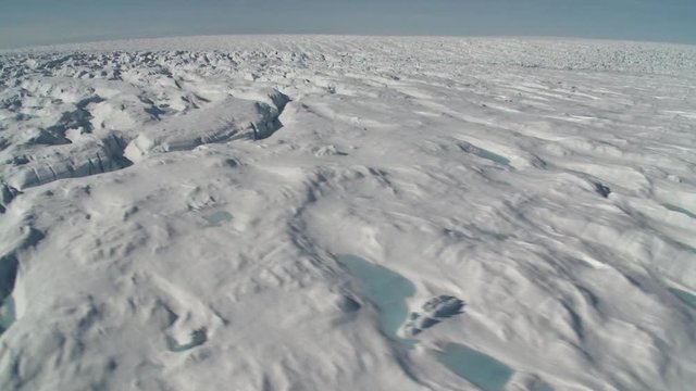 Flying over Greenland tundra, helicopter point of view