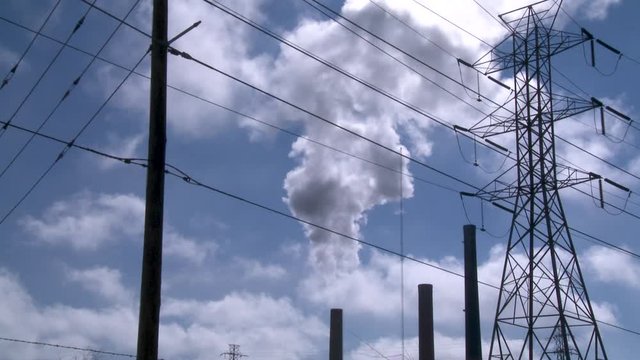Factory releases plume of smoke, low angle