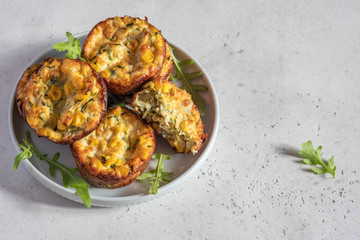 zucchini corn egg muffins on a table