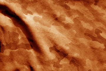 Old military uniform pattern in orange tone.