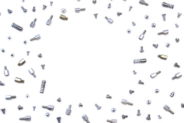 mix of bolts, screws and pins on white background