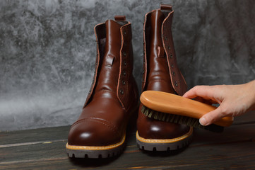 Men's shoes made of genuine leather. Shoe care with a shoe brush.