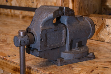 old vise in a workshop, hand press