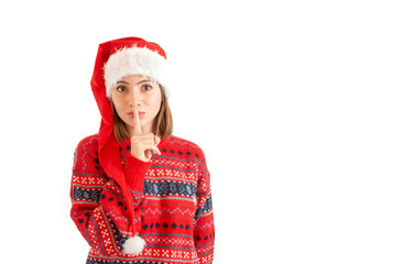 Woman wearing christmas hat over isolated background asking to be quiet with finger on lips. Silence and secret concept.