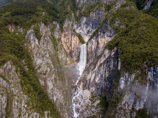 Fototapeta na wymiar Boka Waterfall ( Slap Boka ) is one of the highest waterfalls (139 meters) in the western part of Slovenia, near the Soča River. It has two stages of 106 meters and 33 meters high.