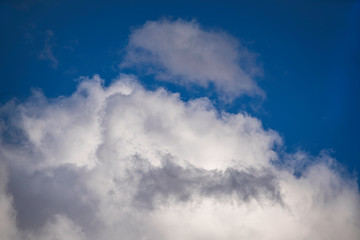 Cloudscape with a blue sky and dramatic clouds.