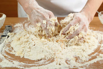 A baker kneading dough. Making Pastry Dough for Hungarian Cake. Series.