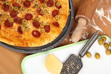 Pizza with Salami, Olives and Cheese. 