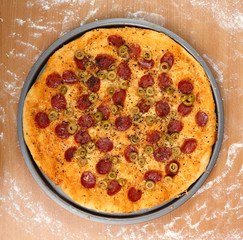 Pizza with Salami, Olives and Cheese. 