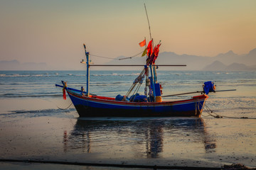 Wooden Longtail Boat on the Beach at Sunrise Morning Time