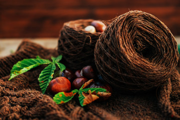Handmade knitted clothes. Brown aran sweater with chestnuts and cinnamon.