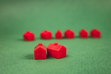 a lot of houses, red on green background.