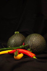 round courgettes and bright hot peppers