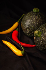 round courgettes and bright hot peppers