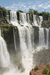 Vertical view of famous natural attraction San Andres fall at Iguazu National Park, Argentina on a sunny summer day