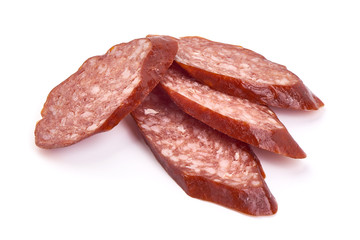 Sliced smoked salami sausage, isolated on white background