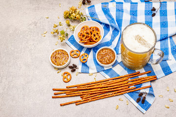 Oktoberfest set. Light beer, pretzels, mustard, sesame straw, hop.
