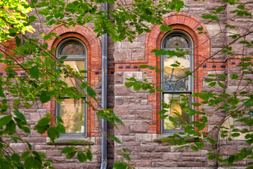 Fototapeta na wymiar Windows in Romanesque Revival Building