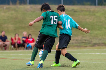 Soccer Players Fighting for the Ball
