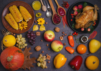 Obraz na płótnie Canvas Chicken or turkey, autumn fruits and vegetables. Thanksgiving food concept. Harvest or Thanksgiving background. Flat lay, horizontal