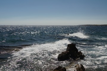 waves crashing on rocks