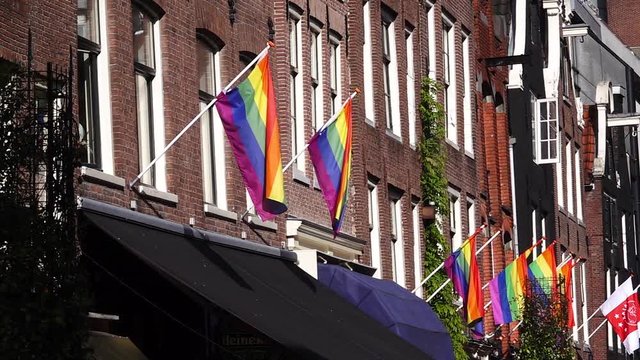 Gay pride rainbow flag LGBT flying. Slow motion