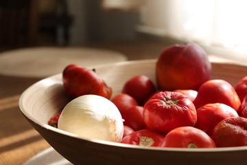 basket with tomatoes and white onion