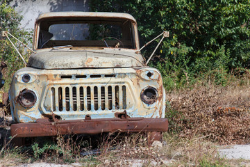 Obraz na płótnie Canvas Abandoned cab of an old rusty soviet truck Gaz-53 
