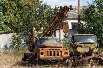 Rusty non-working abandoned soviet truck crane 