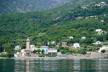 Fototapeta premium Coastline with an orange steeple