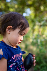 Toddler Girl Exploring Outdoors on Summer Day