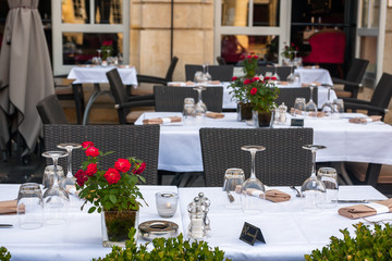 Street view of a Cafe terrace with tables and chairs in Bordeaux, France