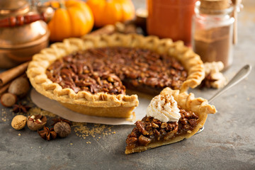 Pecan pie topped with whipped cream for Thanksgiving © fahrwasser