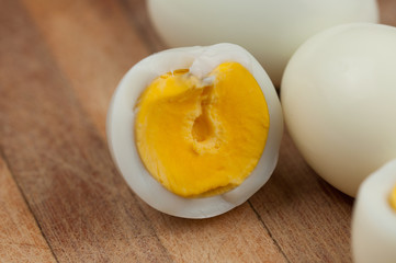 Egg on wooden board isolated on white background