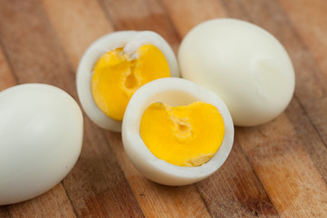 Egg on wooden board isolated on white background
