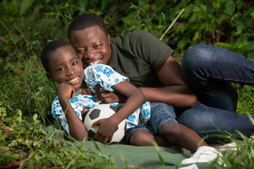 a happy young family in the countryside.