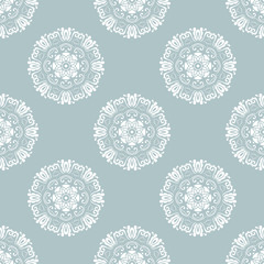 Floral vector ornament. Seamless abstract classic background with flowers. Pattern with repeating white round elements. Ornament for fabric, wallpaper and packaging